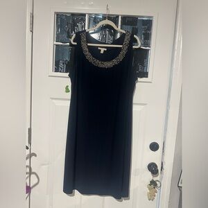 Elegant Black Mini Dress with Embellished Neckline
